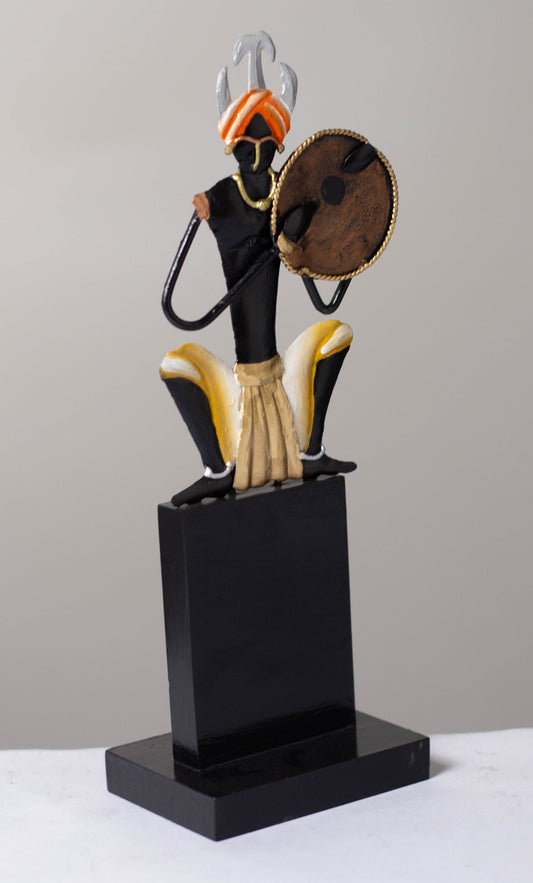 "Tribal Man with Dhapli Memento: Wrought Iron Tribal Man with Dhapli"