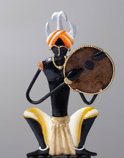 "Tribal Man with Dhapli Memento: Wrought Iron Tribal Man with Dhapli"