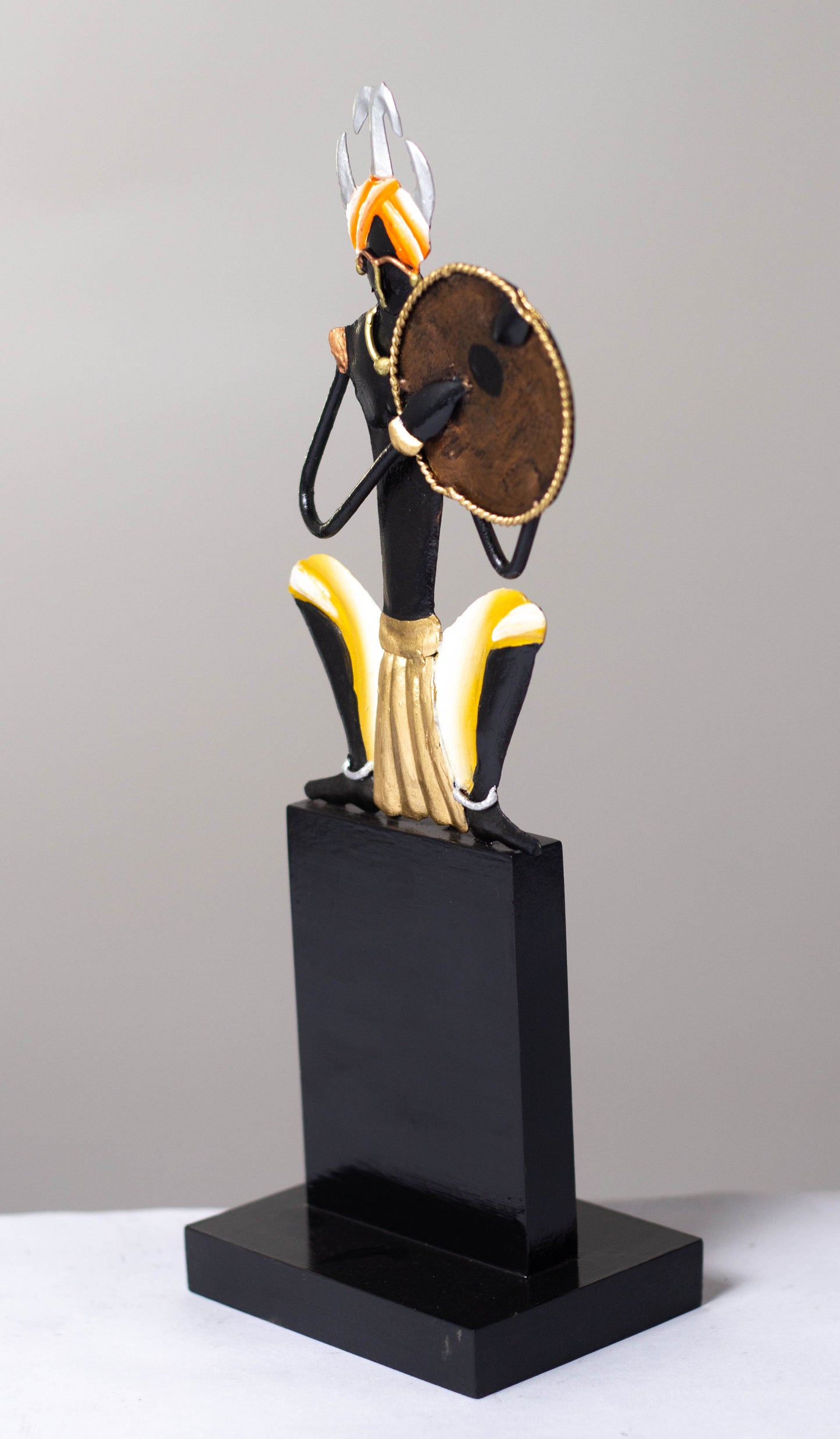 "Tribal Man with Dhapli Memento: Wrought Iron Tribal Man with Dhapli"