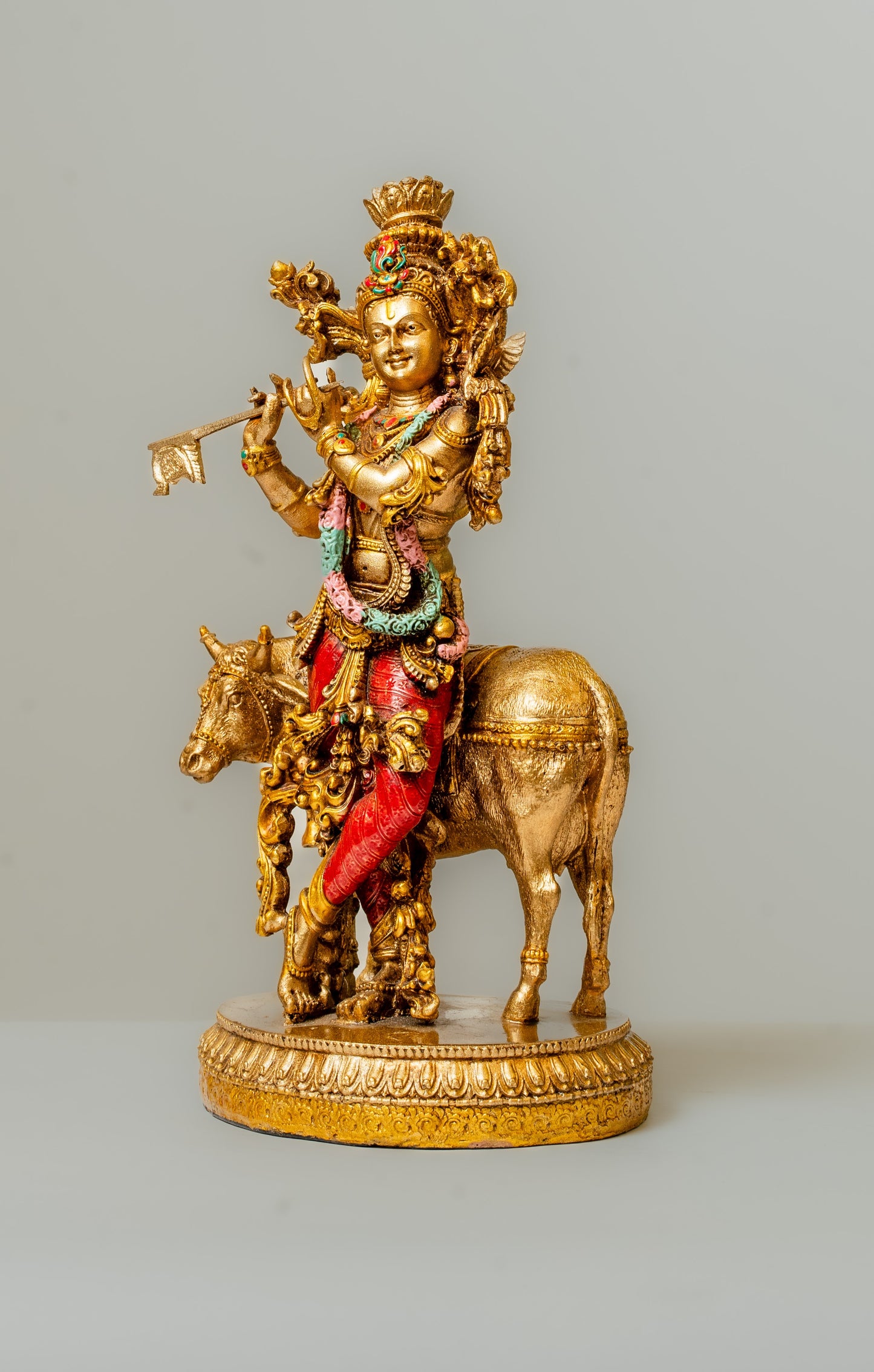 "Cow Krishna Polyresin Statue with Hand-Painted Copper Finish"