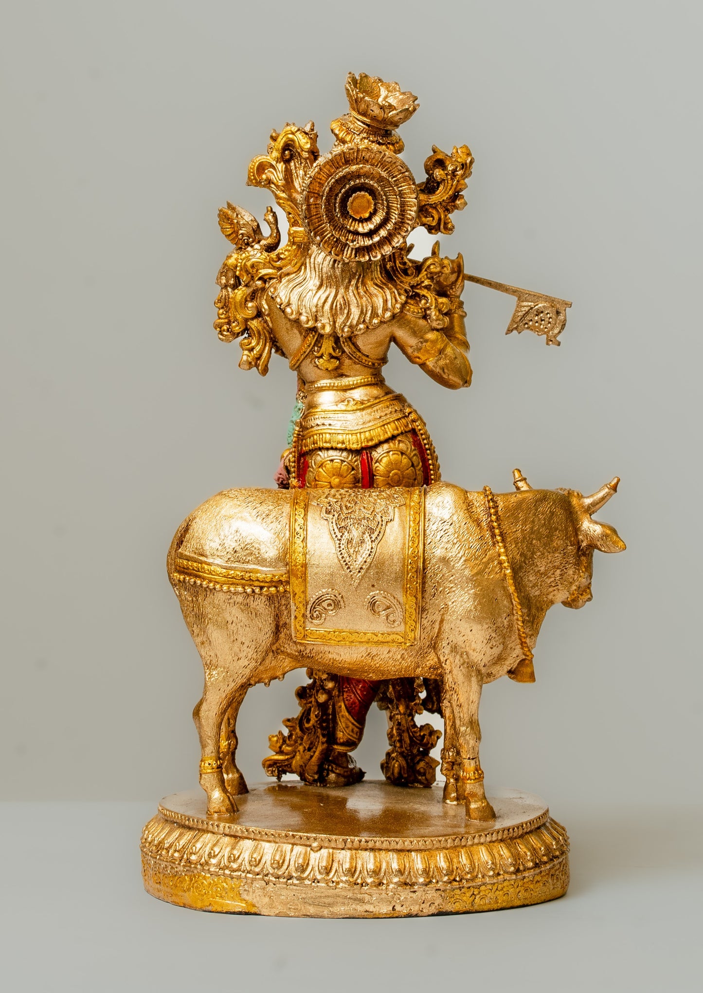 "Cow Krishna Polyresin Statue with Hand-Painted Copper Finish"