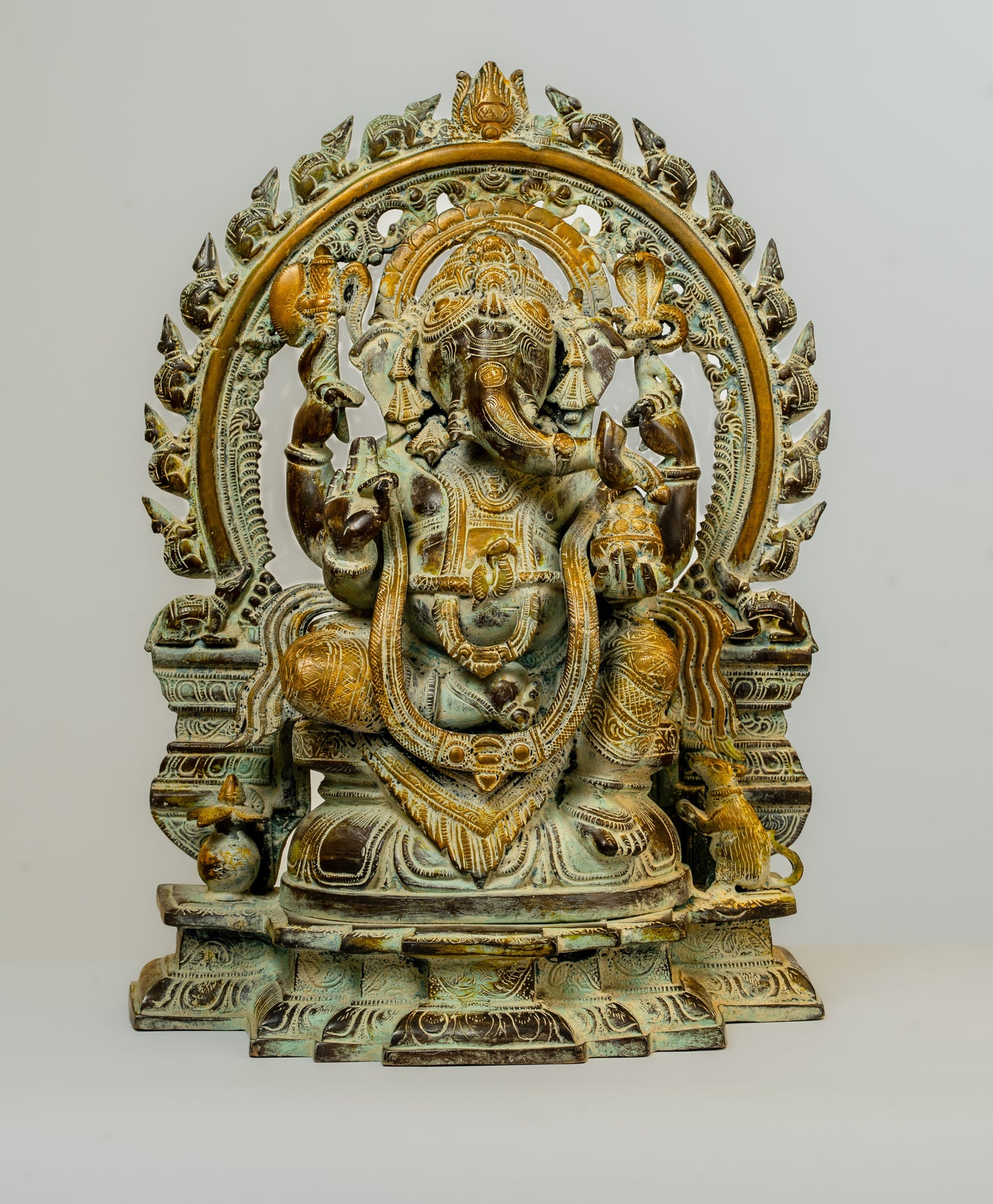 "Antique-Finished Brass Ganesha Statue with Aura Circle"