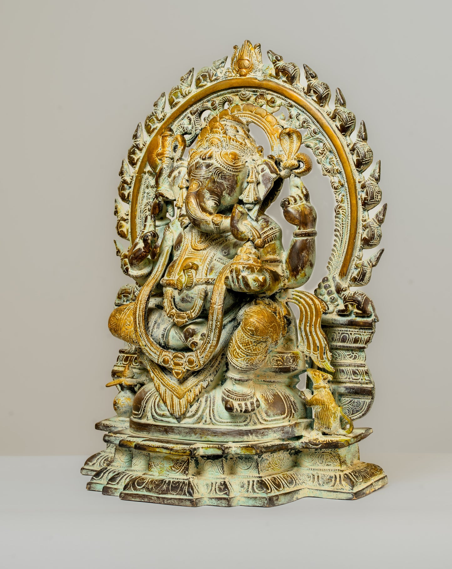 "Antique-Finished Brass Ganesha Statue with Aura Circle"