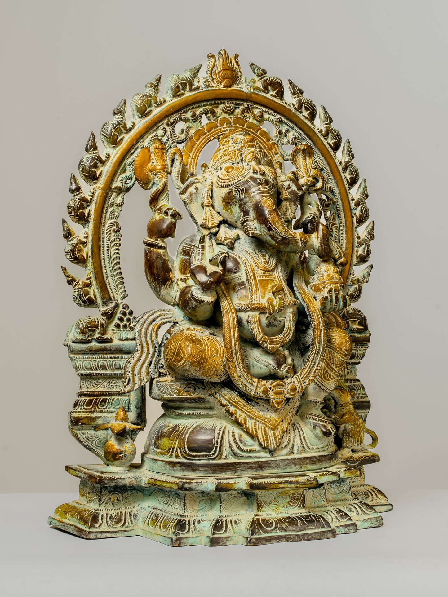 "Antique-Finished Brass Ganesha Statue with Aura Circle"