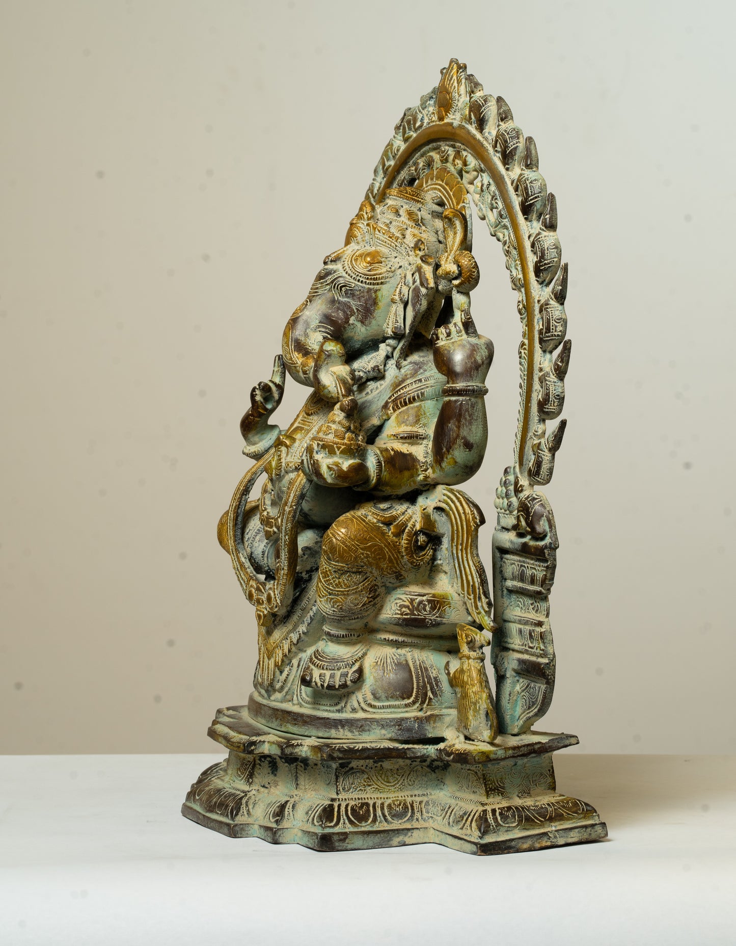 "Antique-Finished Brass Ganesha Statue with Aura Circle"