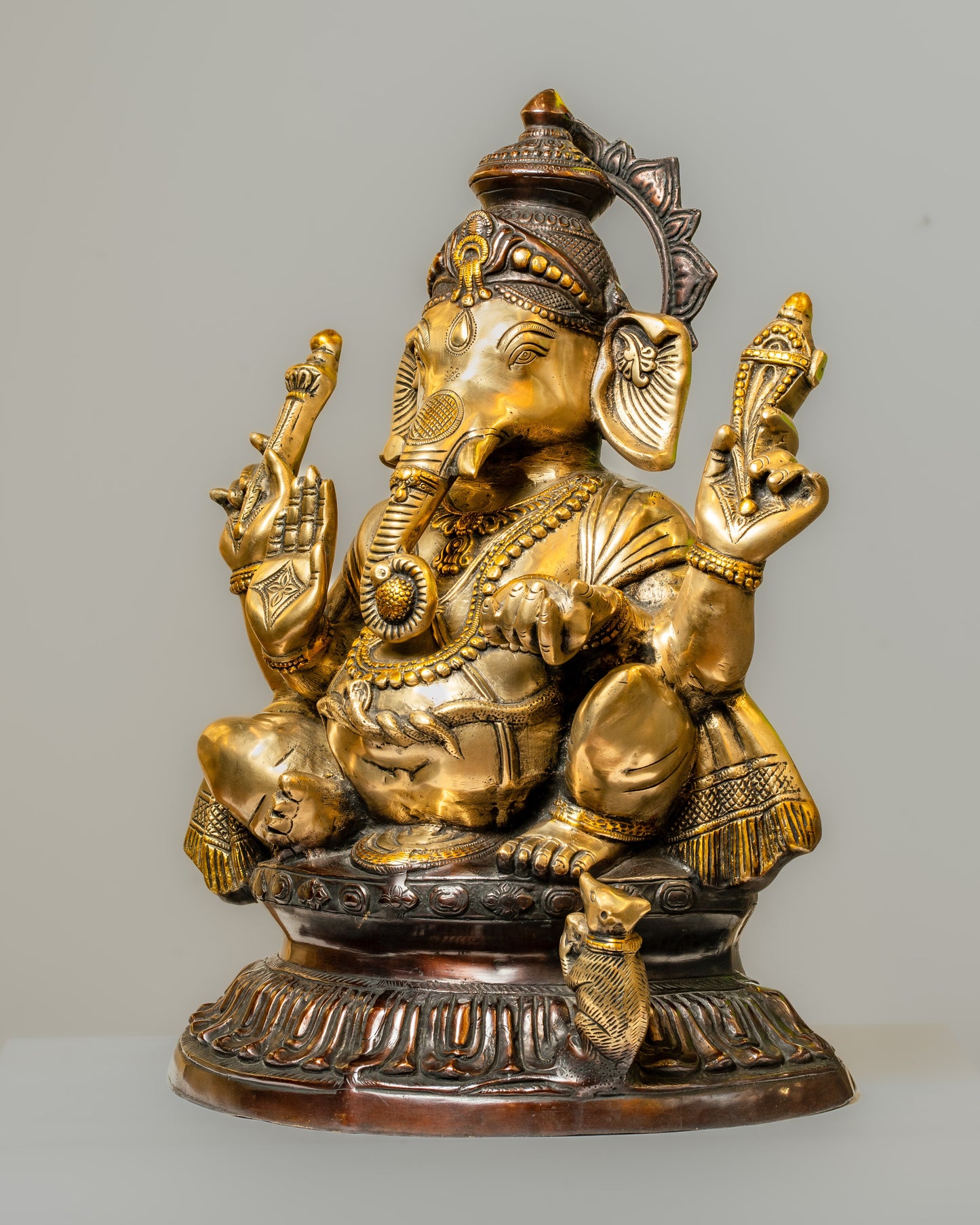 "Regal Ganesha Brass Statue with Dual-Tone Black Finish"