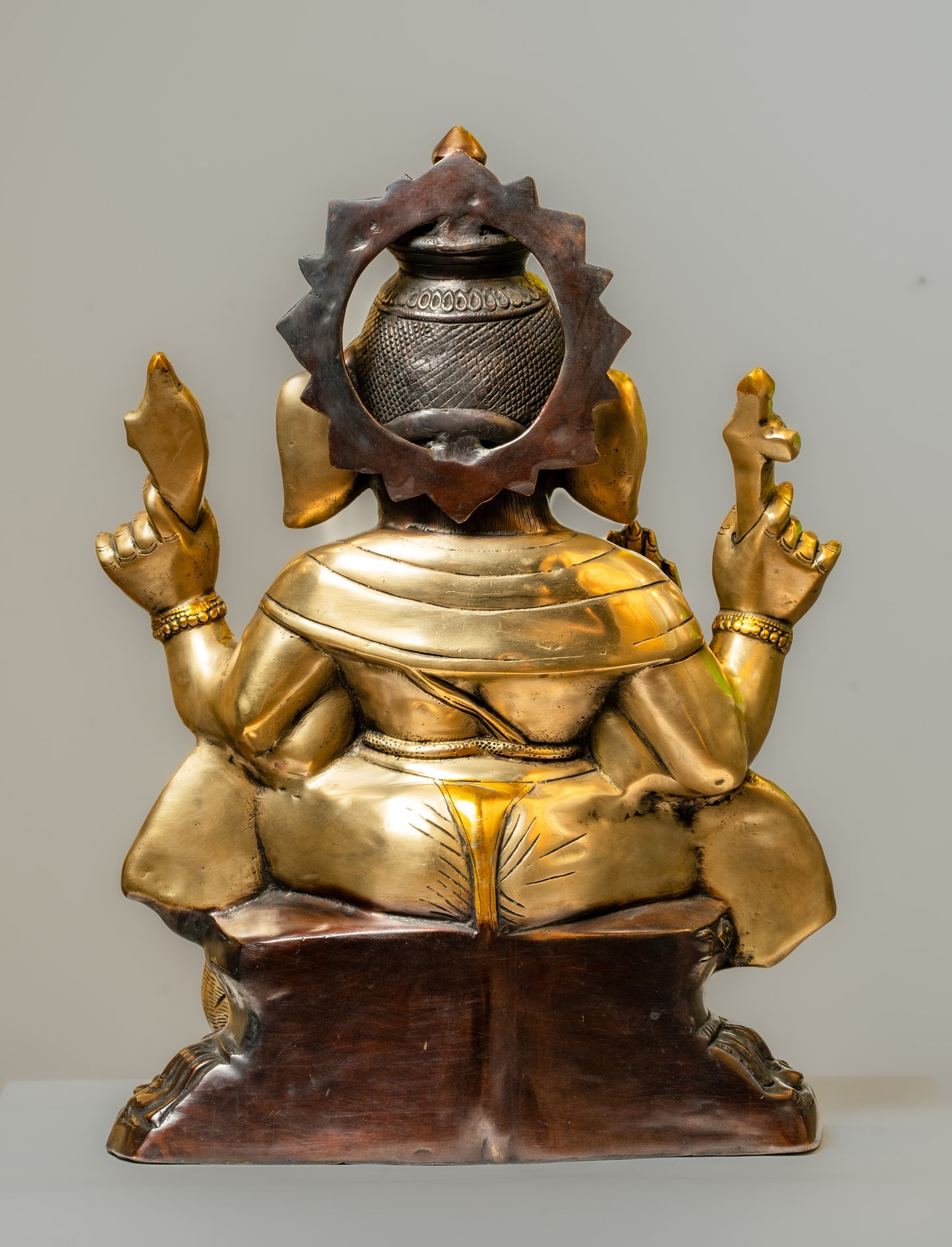 "Regal Ganesha Brass Statue with Dual-Tone Black Finish"