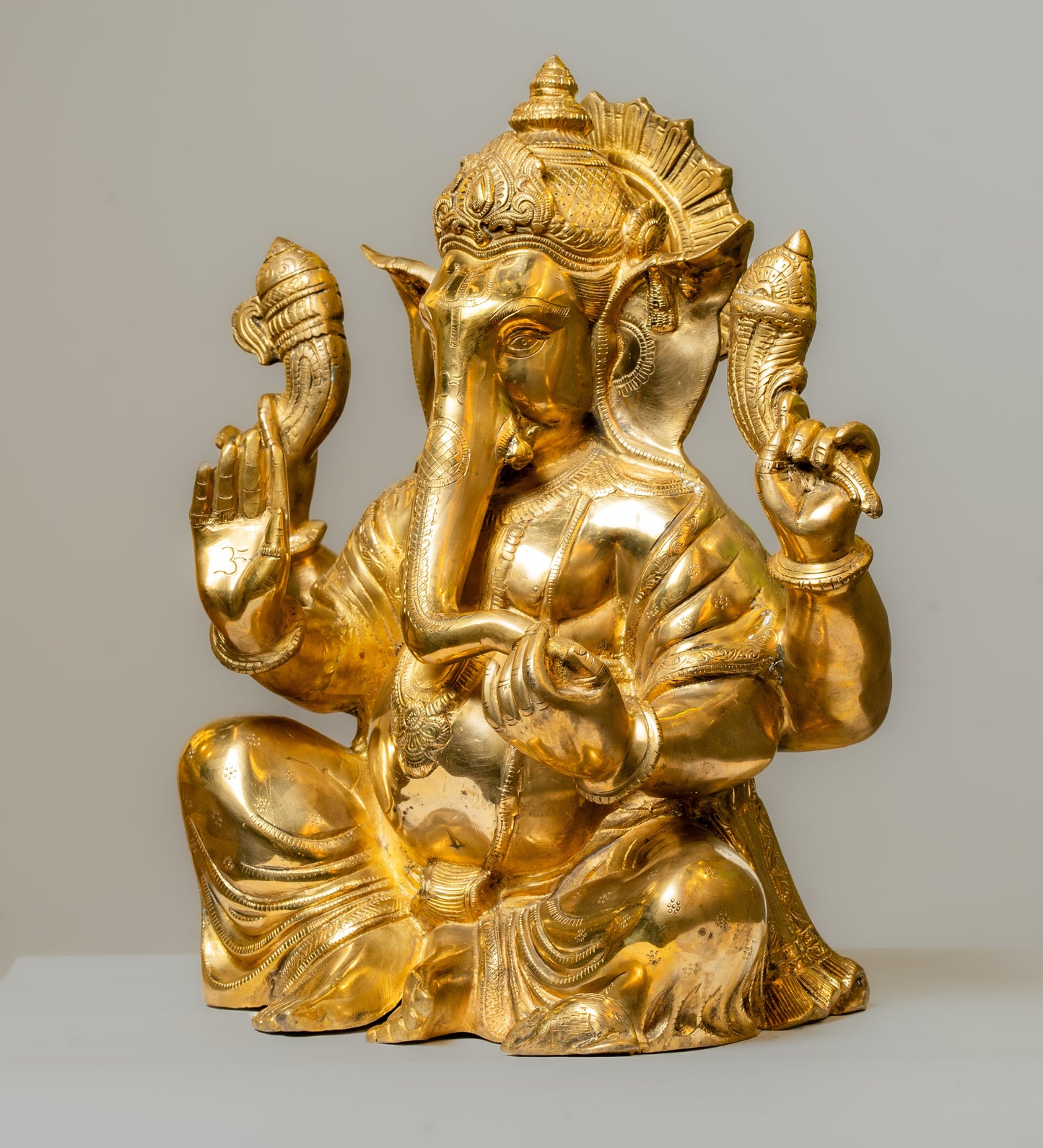 "Lustrous Gold-Finish Brass Ganesha Statue"