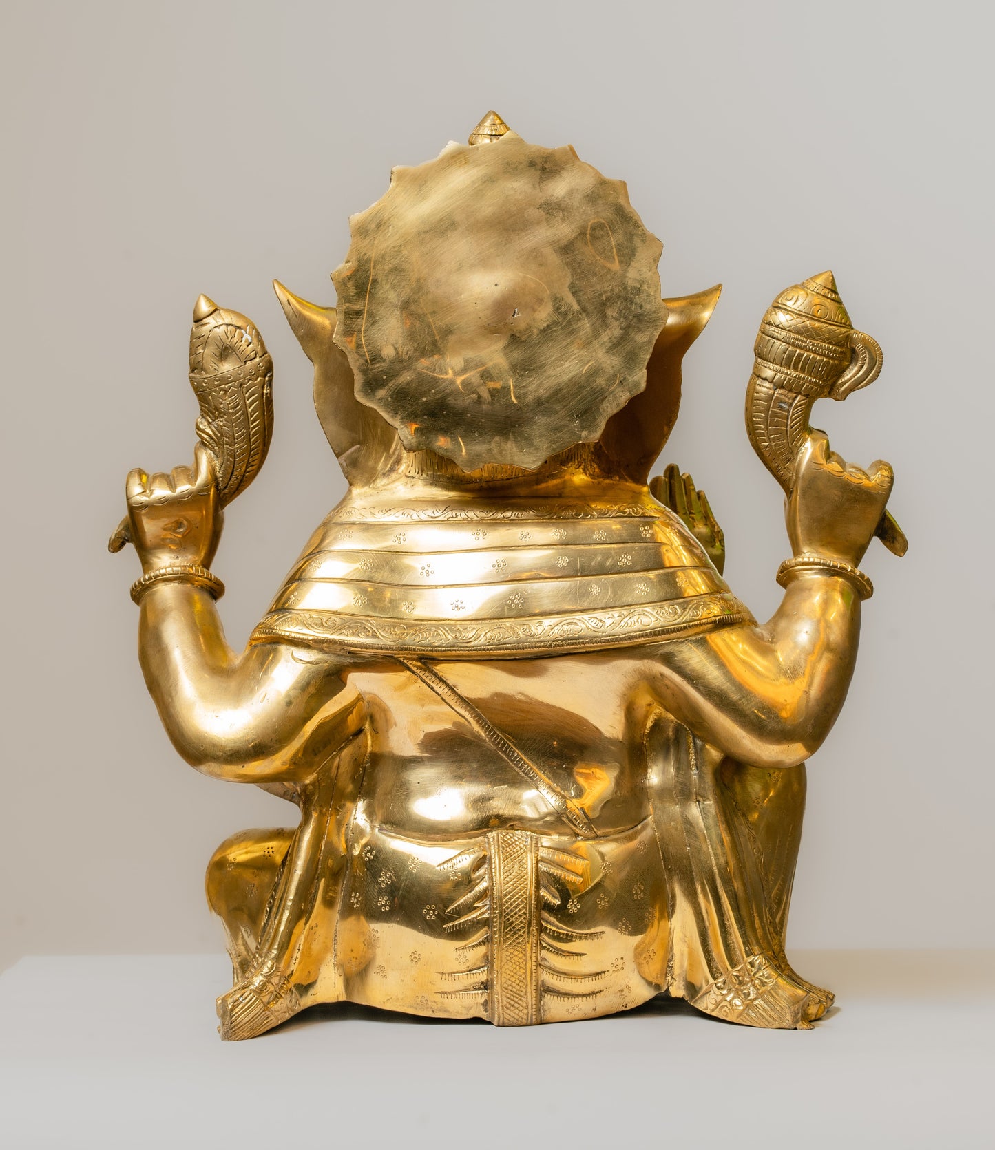 "Lustrous Gold-Finish Brass Ganesha Statue"